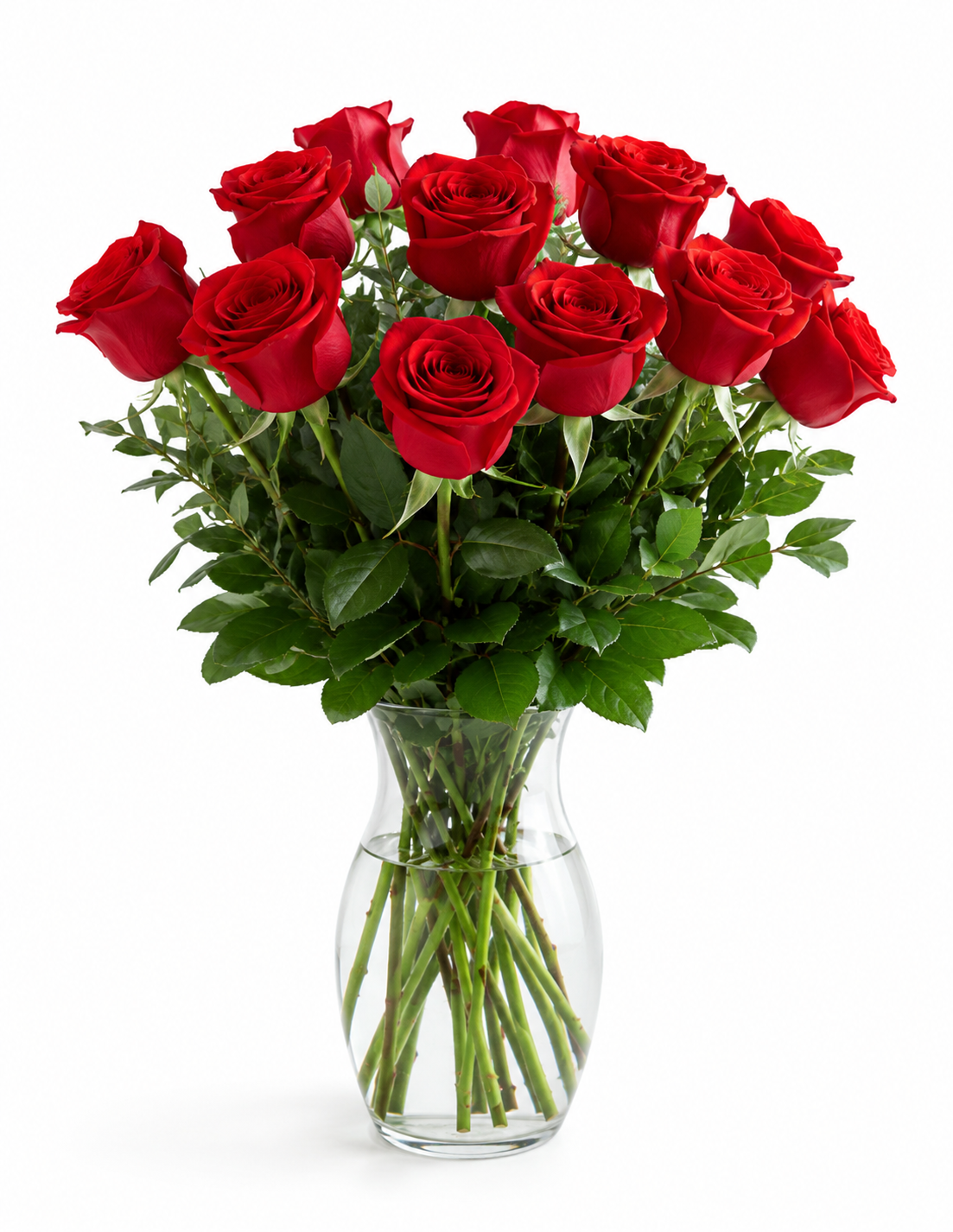 one dozen red roses in a clear vase