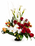 Floral arrangement with red roses, white lilies, white orchid and orange tulips